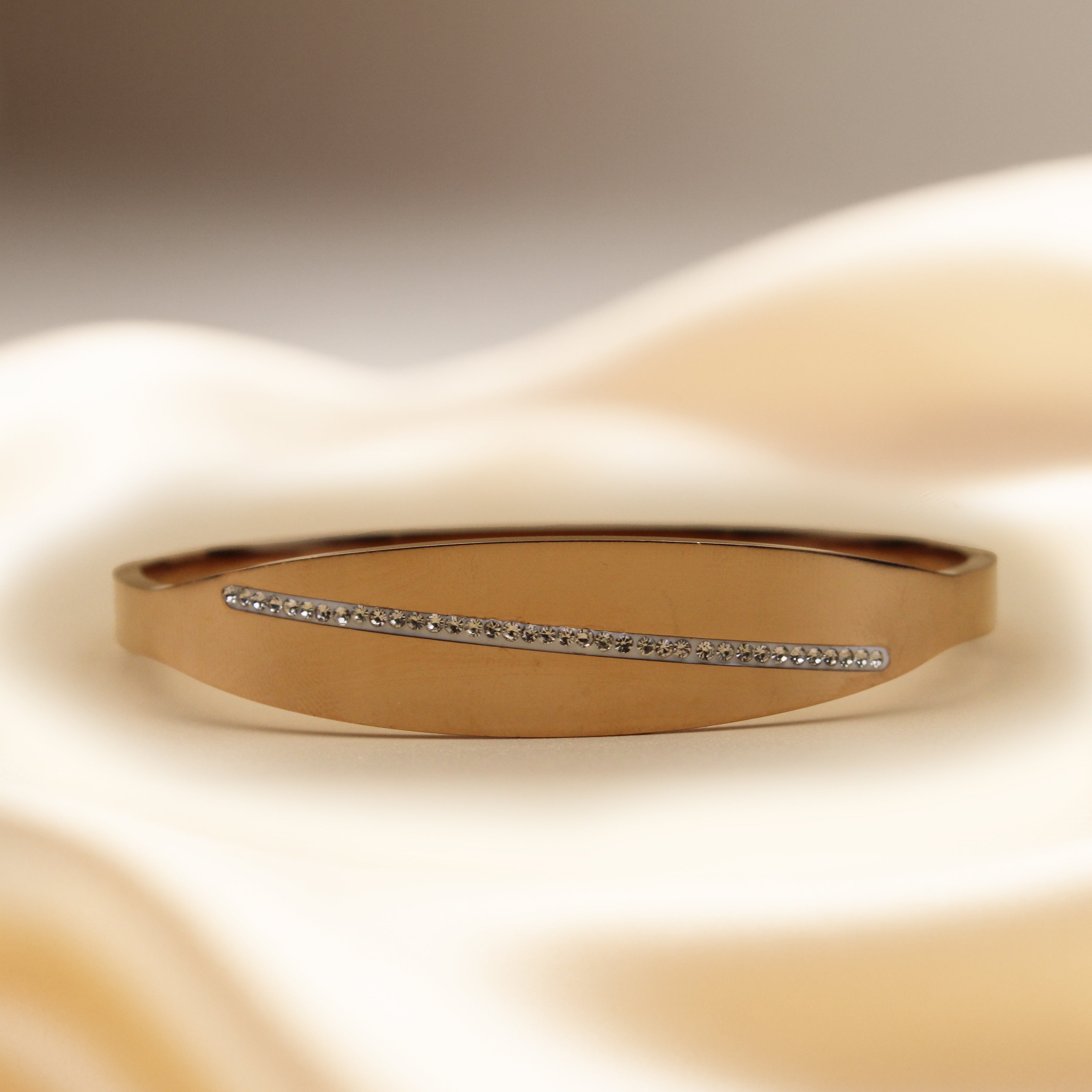 Contemporary Gold Tone Bangle with Subtle Sparkle