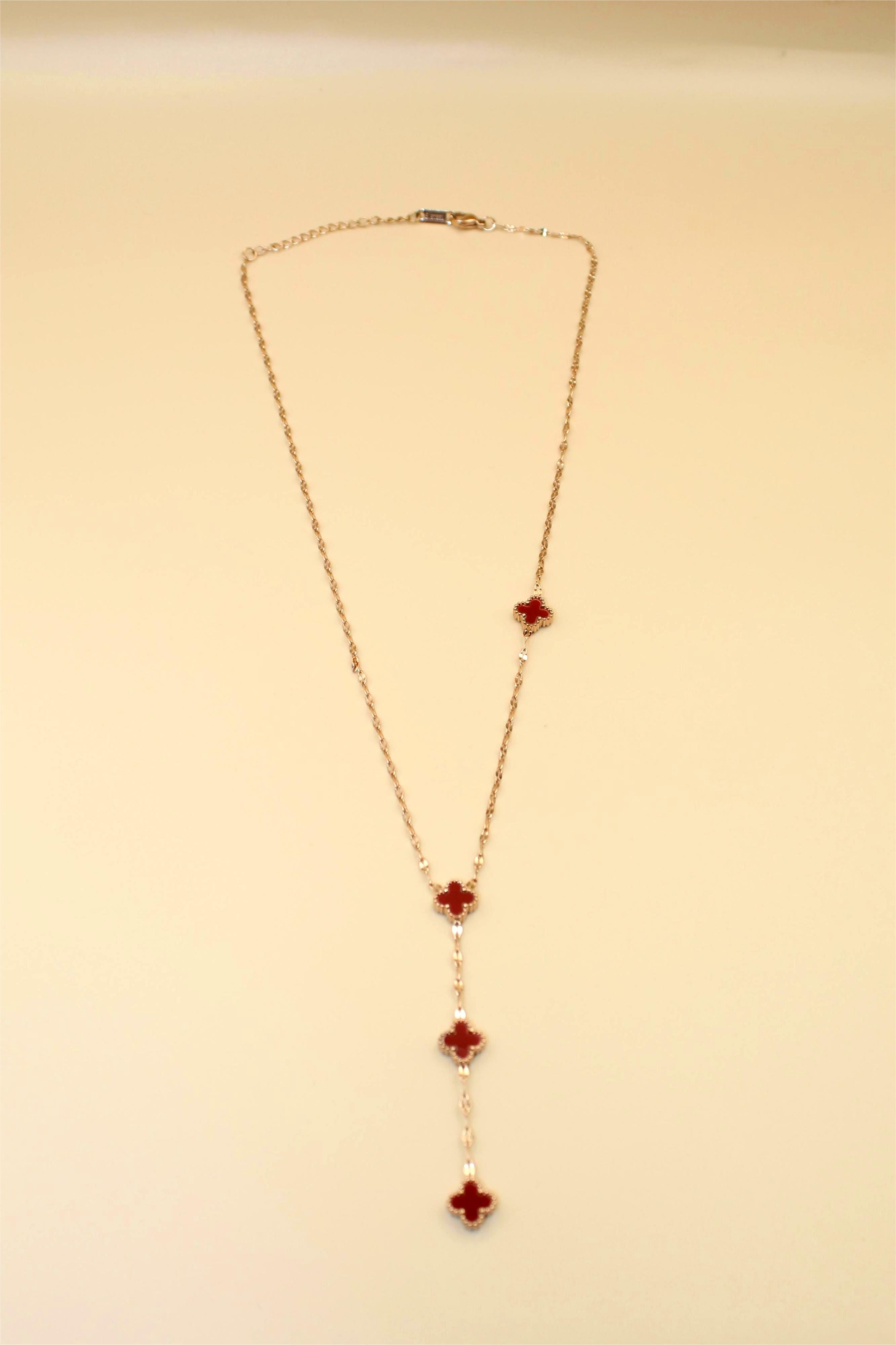 Gold-Tone Chain Adorned With Elegant Red Stone