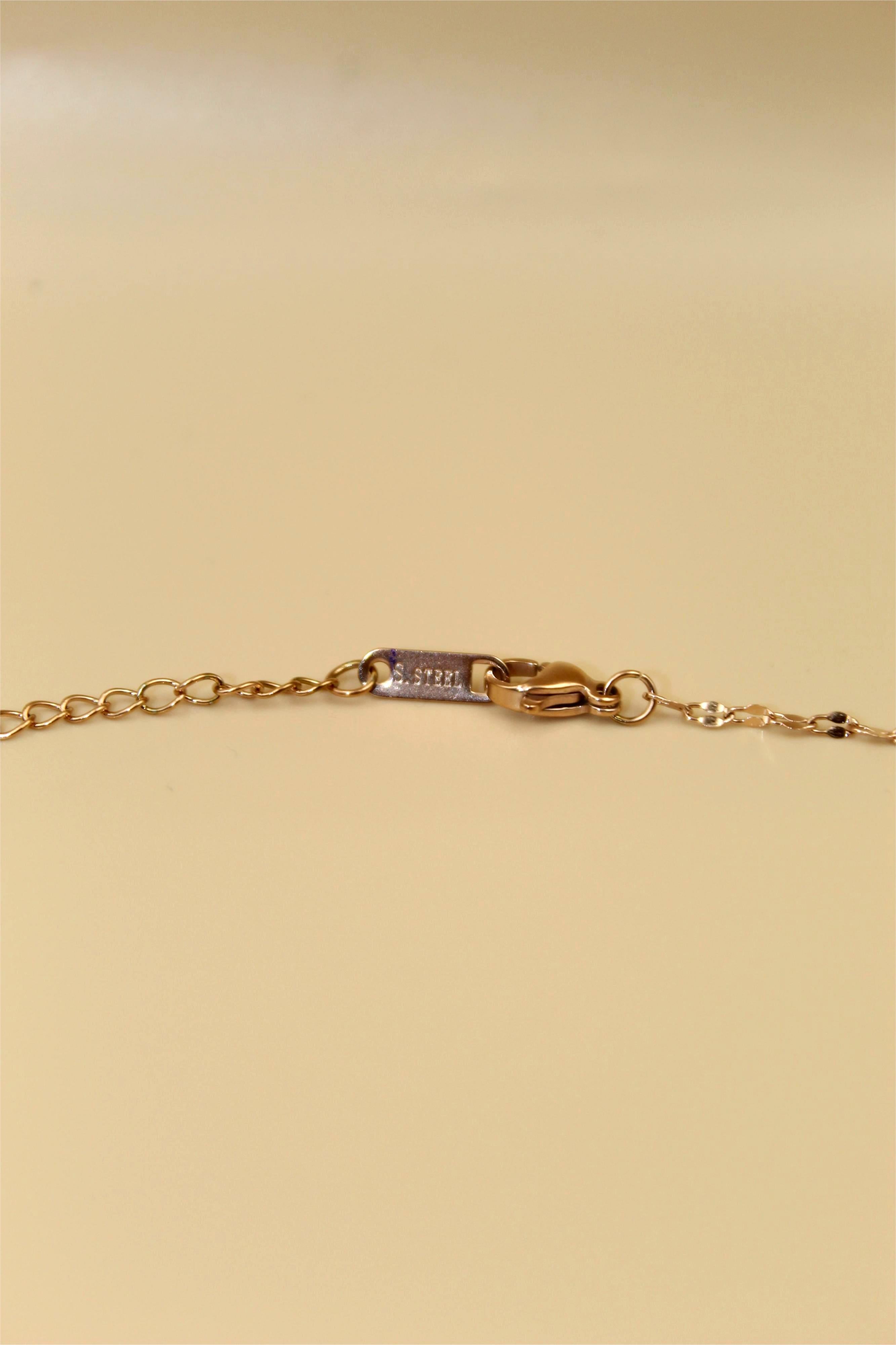 Gold-Tone Chain Adorned With Elegant Red Stone