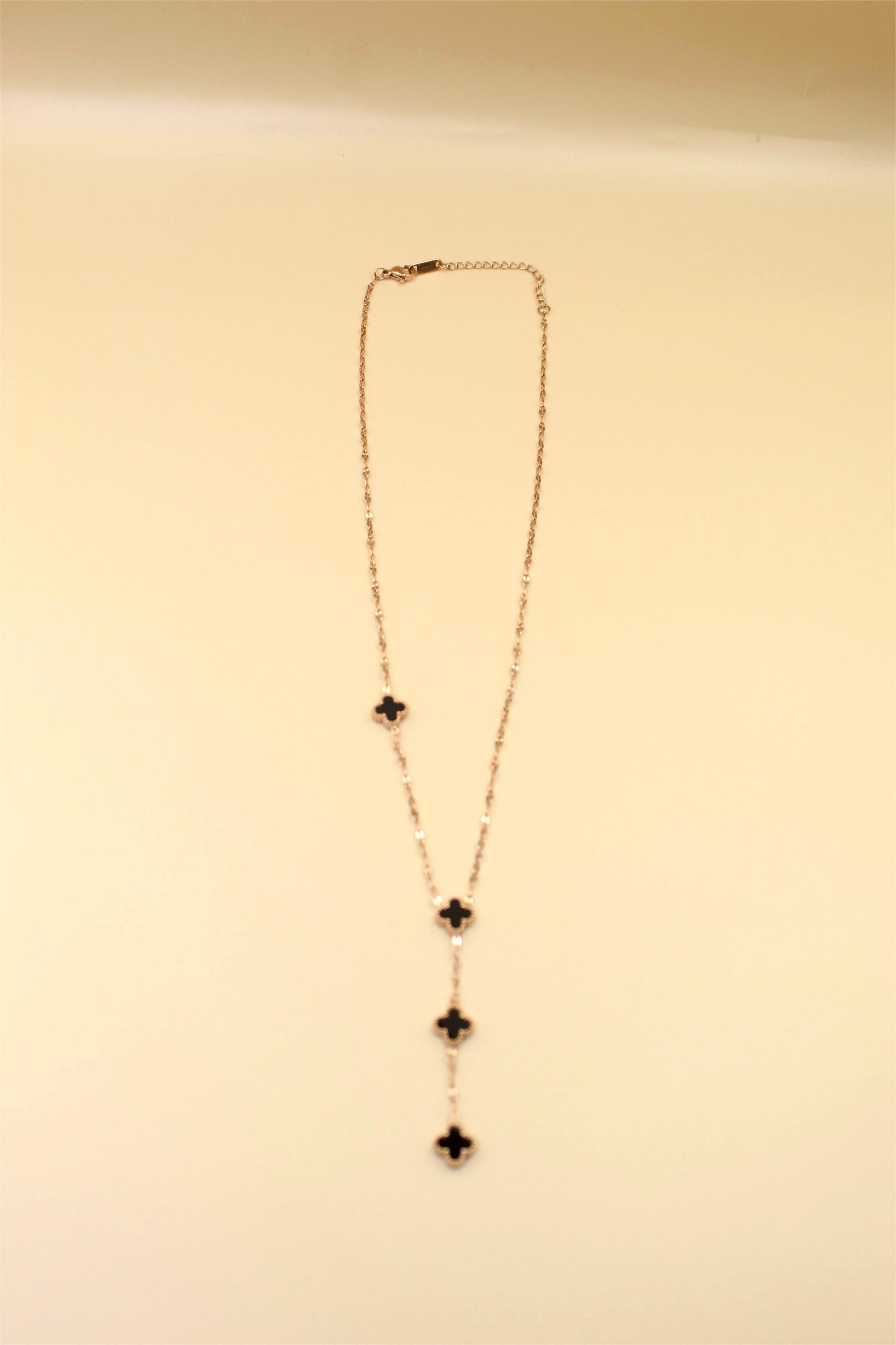 Gold-Tone Chain Adorned with Elegant Black Stone