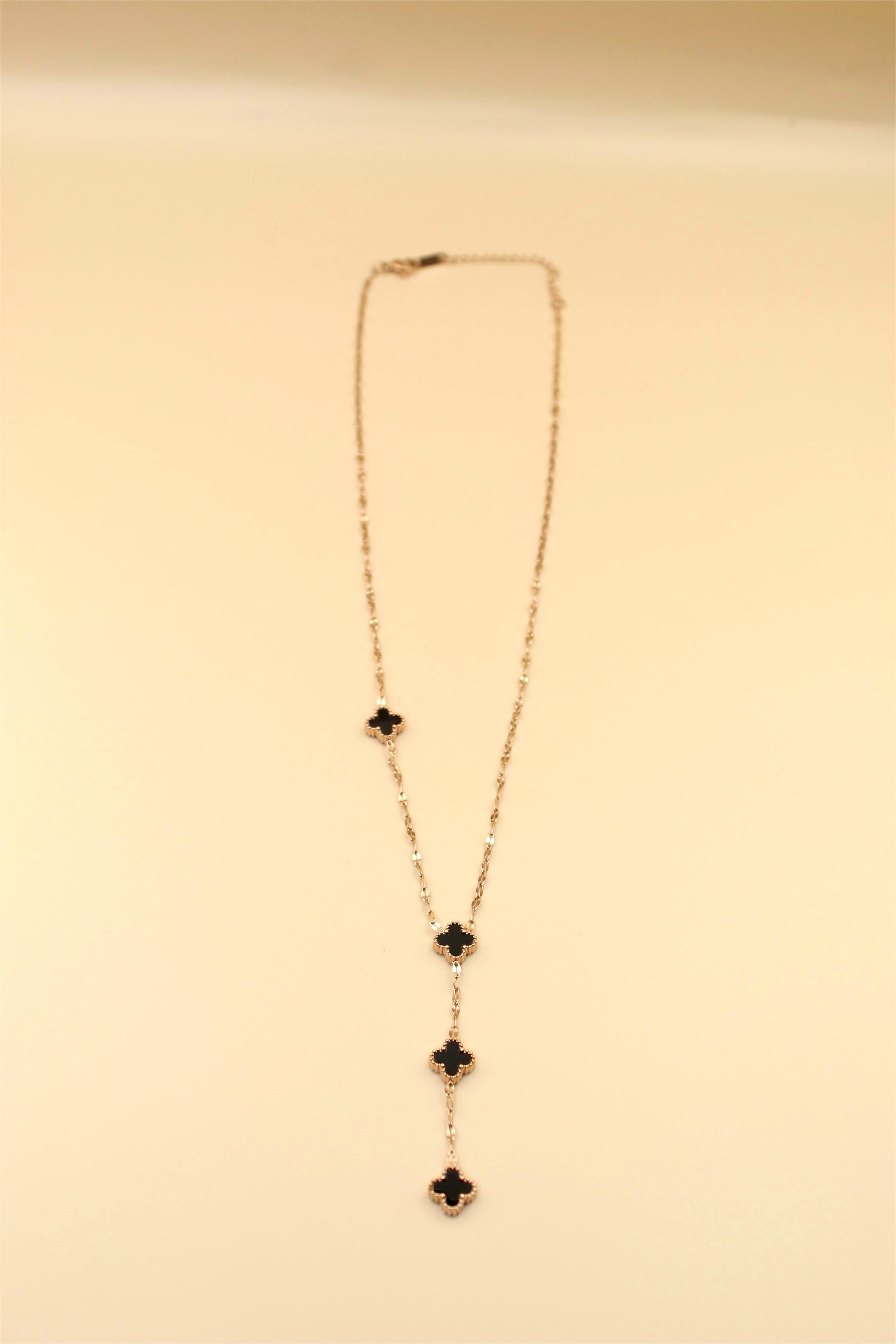 Gold-Tone Chain Adorned with Elegant Black Stone