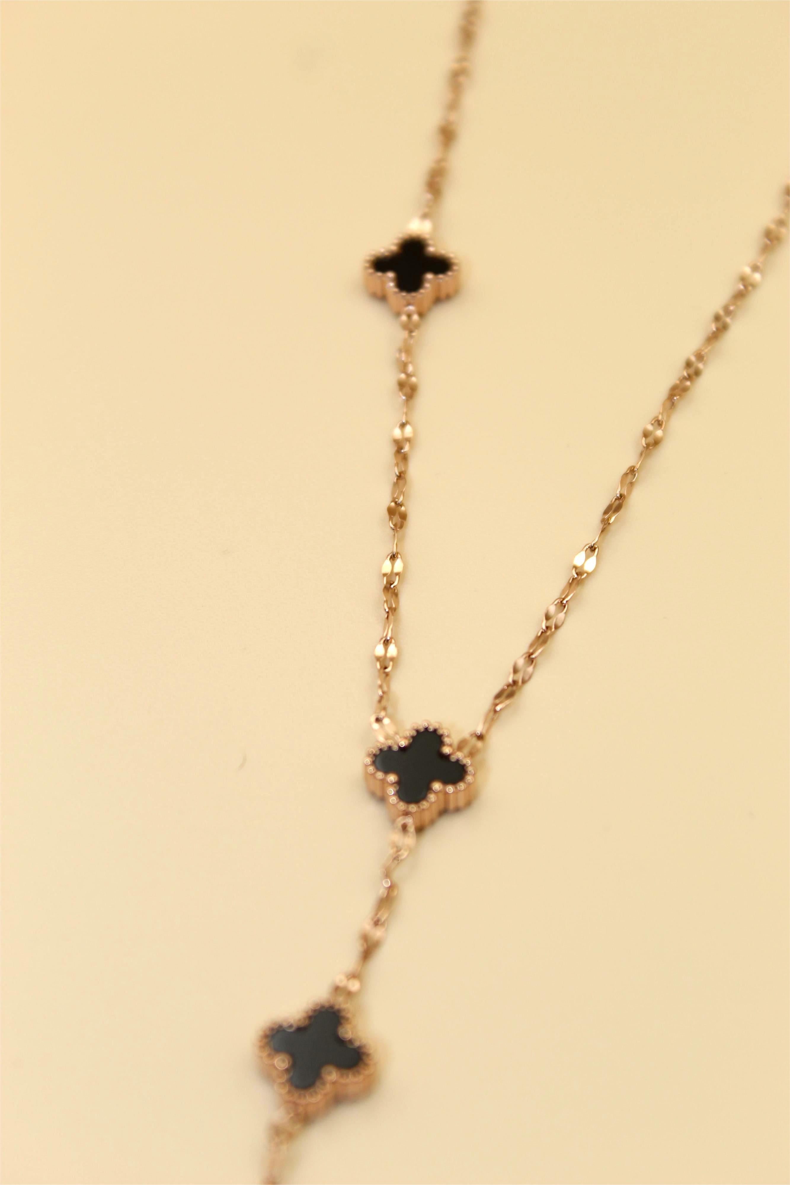 Gold-Tone Chain Adorned with Elegant Black Stone