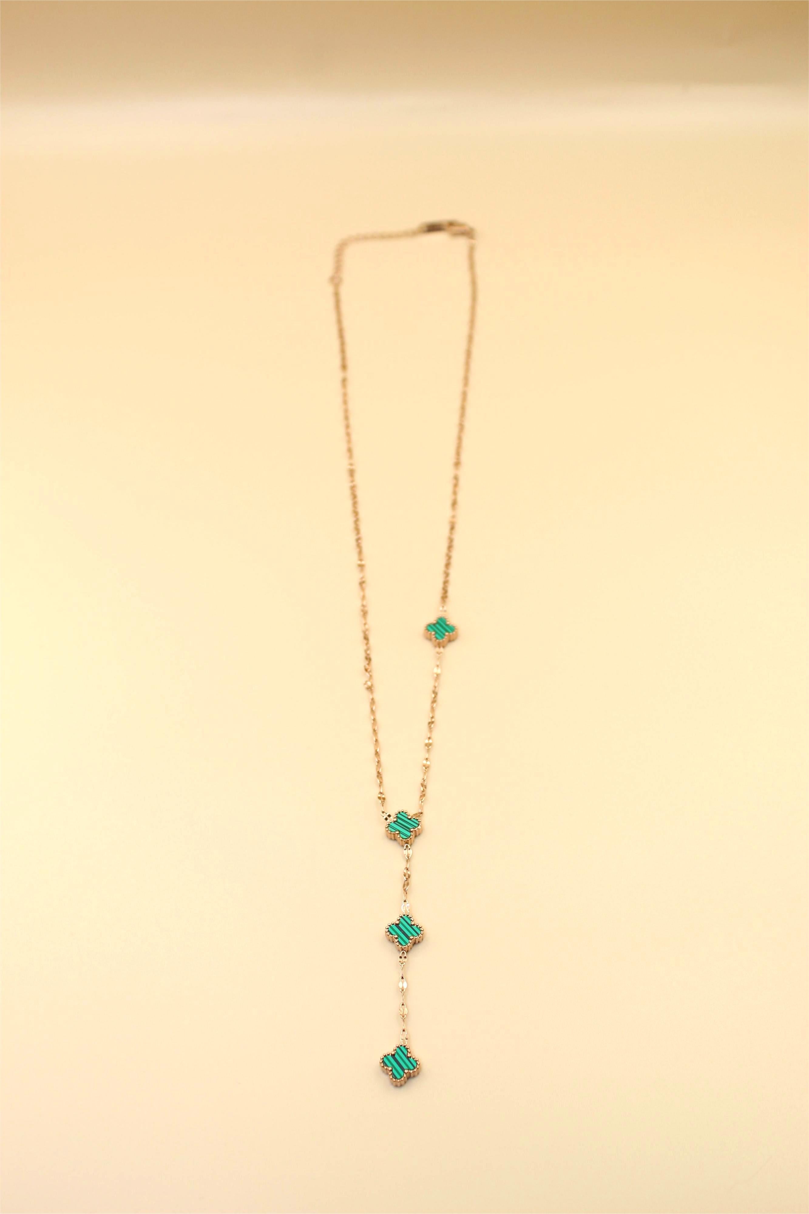Gold-tone chain adorned with elegant aqua blue stone