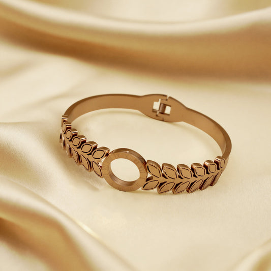 Modern Gold Finish Leaf Pattern Bangle with Circular Centerpiece